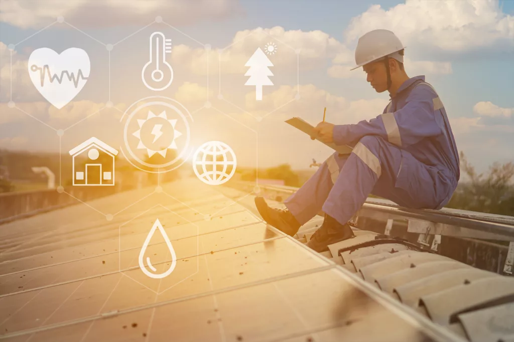 Industry worker looking at tablet with environmental safety icons such as temp, moisture, etc.